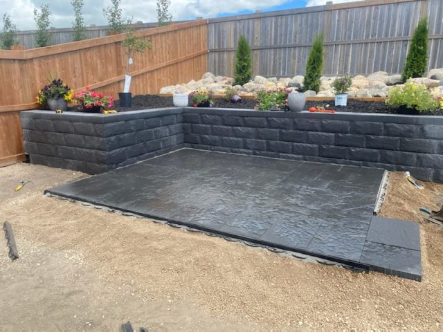 Adding patio by retaining wall