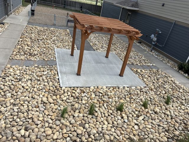 Concrete pad with Pergola and pathways